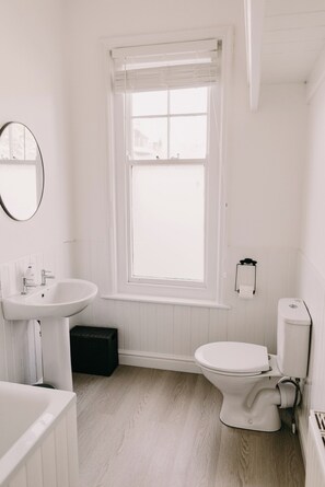 Shower, hair dryer, towels, toilet paper