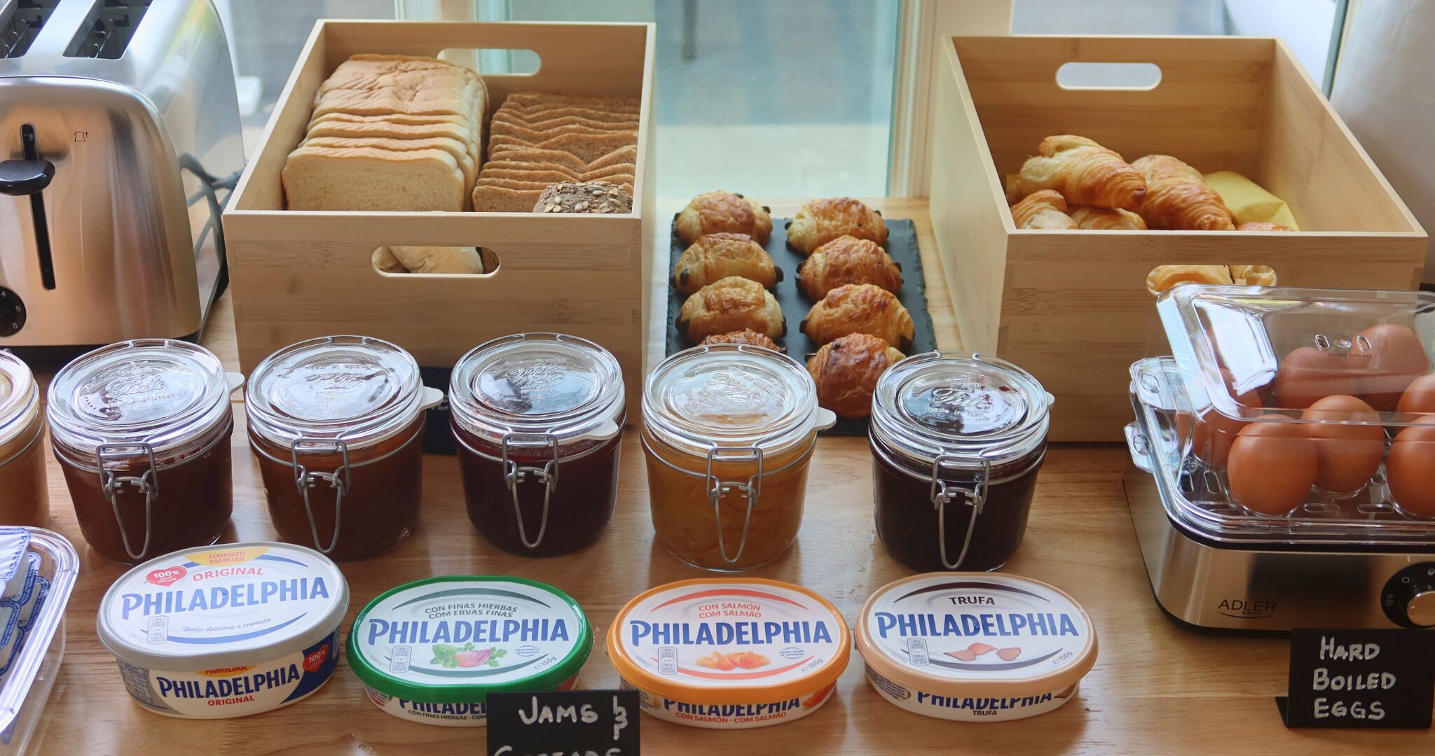A display of Philadelphia condiments and pastries in a bakery setting.