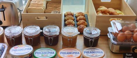 A display of Philadelphia condiments and pastries in a bakery setting.