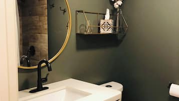 Separate bathtub and shower, hair dryer, towels, soap