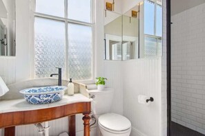 Shower, hair dryer, towels, shampoo