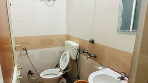 A small bathroom with a toilet, sink, and shower. - Delux Room Nearby Banke Bihari Only 2min walking

 (Sunrakh Bangar)