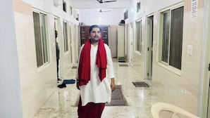 A corridor with doors on both sides, a ceiling fan, and a chair in the foreground. - Delux Room Nearby Banke Bihari Only 2min walking

 (Sunrakh Bangar)