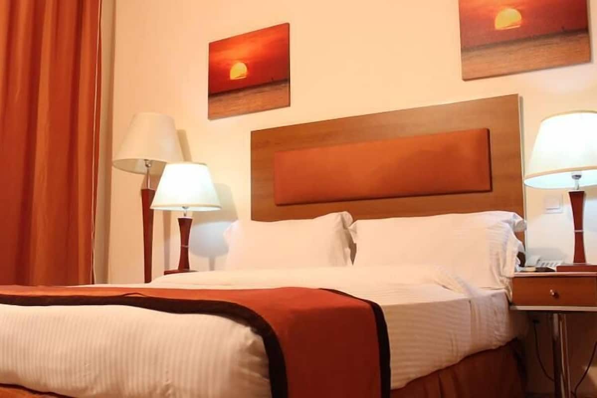 Family Room, Balcony, City View | Desk, laptop workspace, soundproofing, free WiFi