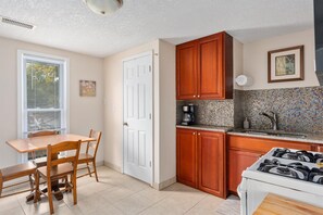 Fridge, microwave, oven, stovetop - Dahlia Apartment - In Quiet Corcoran Neighborhood with Easy Access to Downtown (Minneapolis)