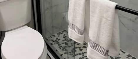 Hair dryer, towels, soap, toilet paper