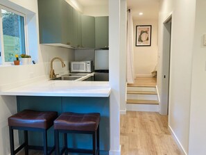 Fridge, microwave, stovetop, cookware/dishes/utensils