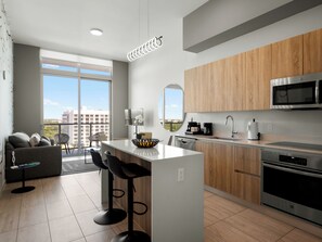 Apartment, City View | Private kitchen | Coffee/tea maker, toaster, blender, cleaning supplies - Modern Condo in Design District (Miami)