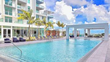 Outdoor pool, pool umbrellas, sun loungers