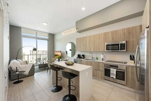 Apartment, City View | Private kitchen | Coffee/tea maker, toaster, blender, cleaning supplies - Modern Condo in Design District (Miami)