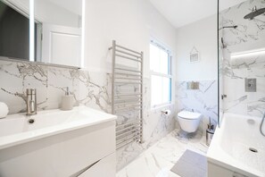 Shower, hair dryer, towels, soap