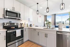 Fridge, microwave, oven, stovetop - Modern 2 BR Apt in Philly with a Glass City View (Philadelphia)