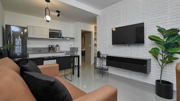 Superior Apartment, Balcony | Living area | Flat-screen TV
