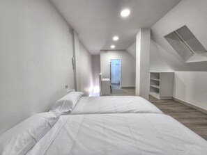 1 bedroom, desk, iron/ironing board, travel crib