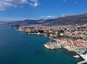 Stunning coastal town with a historic fortified structure and waterfront views.