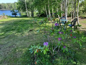 Property grounds - Holiday home with panoramic views over the lake and private boat (Holmsjö)