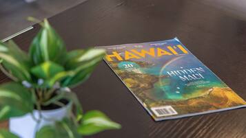 A magazine titled "Hawaii" on a wooden table.