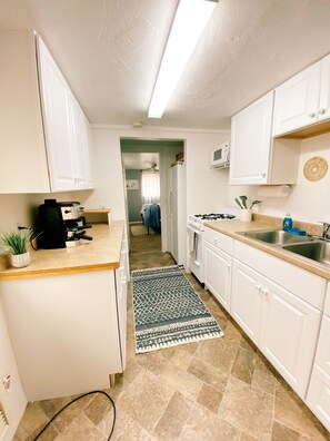 Fridge, microwave, oven, dining tables