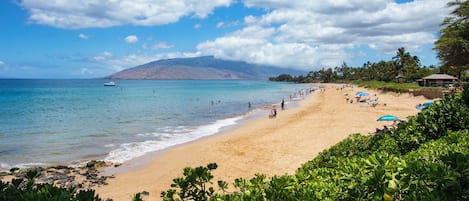 Beach nearby, white sand, beach towels