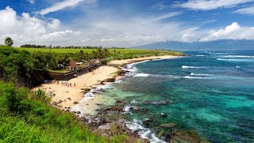 Beach nearby, white sand, beach towels