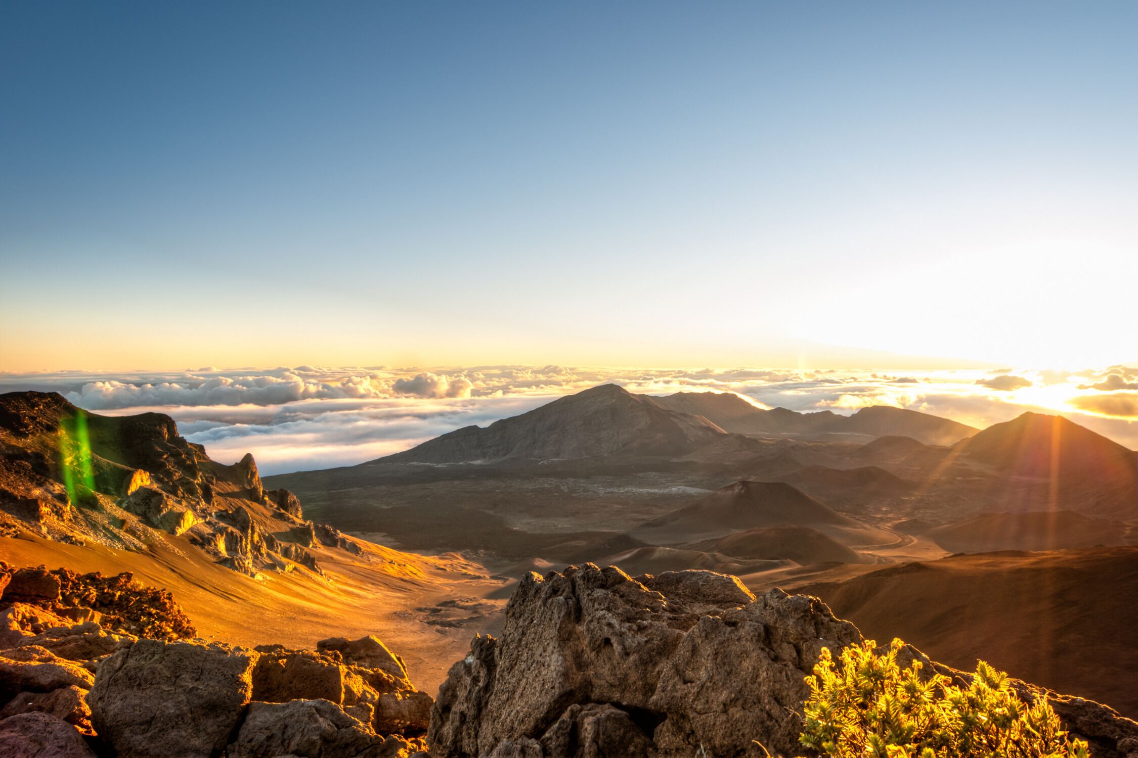 A mountainous landscape with rocky terrain and sparse vegetation.