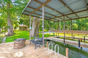 Lounge by the second firepit on the spacious dock! - Beautiful Lakefront Cabin | Firepit | Grill Smoker (New Braunfels)