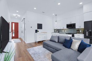 Bright living space with queen sofa sleeper, Smart TV, and workspace - Luxury Resort-Style Living | Centrally Located (New Braunfels)