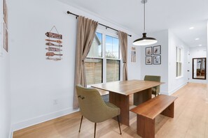 Gather for meals together at the dining table or sip coffee at the kitchen island