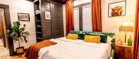 The second of two fashionable bedrooms, offering a king bed & Smart TV