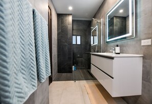 Shower, hair dryer, towels, soap