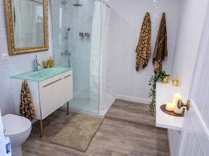 Shower, hair dryer, towels, toilet paper
