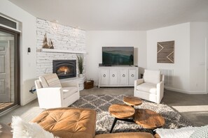 Smart TV, fireplace, books, printers