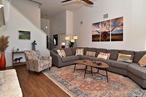 Curl up in the airy living room & enjoy a movie night in style