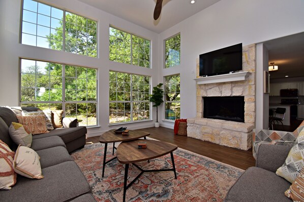 Curl up in the airy living room & enjoy a movie night in style