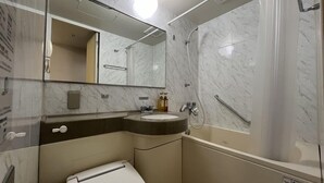 A modern bathroom with a marble sink, a mirror, a shower, and a toilet. - Hotel Alpha-One Koriyama-Higashiguchi (Koriyama)