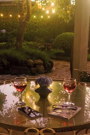 A glass table with two wine glasses, a smartphone, and a pair of glasses. - Villa de Vientos, Your Escape from the City, Apt. 3 (Apaneca)