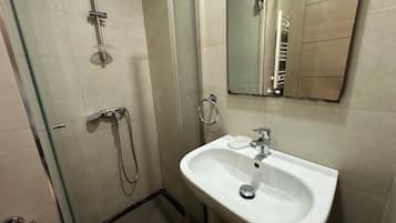 Shower, towels, soap, toilet paper