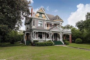 A large, two-story Victorian-style house with a wrap-around porch and a green lawn. - The Kate Shepard House is a beautiful Queen Victorian catalog home that was built in 1897. Come experience a genuine southern getaway complete with charm and comfort in this beautiful 6 bedroom 6 and half bathroom home in Mobile Alabama. Plenty of ro (Mobile)