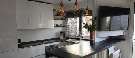 Fridge, microwave, stovetop, coffee/tea maker