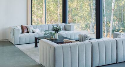 Bellevue: A cozy, Scandinavian-style cottage nestled on a hill.