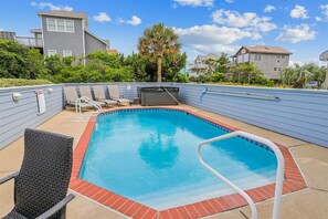 A rectangular swimming pool with a red brick border, surrounded by a blue wall. - "Summer Splendor" OCEAN VIEWS  Private Pool Hot Tub Direct Beach Access!! (Corolla)