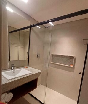 Shower, towels, shampoo, toilet paper
