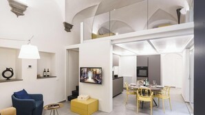 A modern interior with a dining area, kitchen, and living space.