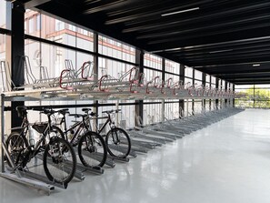 Bicycles are stored in a well-maintained area with easy access.