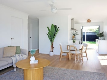 This Bright, airy living space with open-plan design is perfect for relaxing.