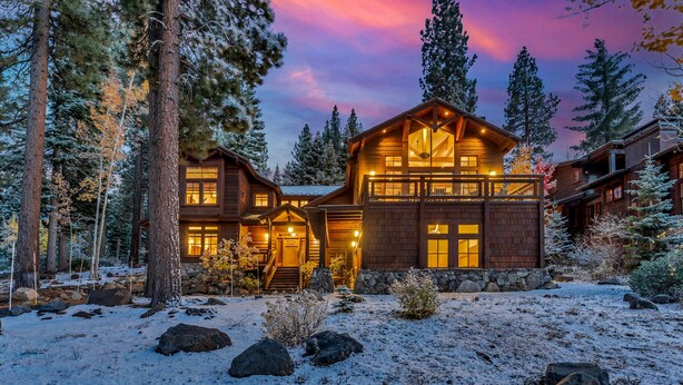 A log cabin with a stone foundation, wooden exterior, and a balcony. - Northstar Ski-In/Ski-Out with Hot Tub & Views (Northstar)