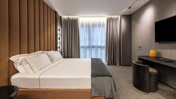 Signature Studio | Premium bedding, down comforters, in-room safe, desk