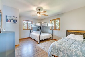 A bedroom with a bunk bed, a desk, and a ceiling fan. - Dock & Views: Waterfront Home in Wabasha! (Wabasha)