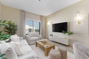 Deluxe Apartment, 1 Bedroom, Balcony, Canal View | Living area