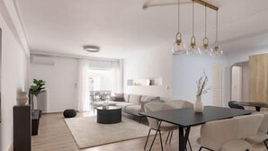 A modern living room with a sofa, coffee table, and dining table with chairs. There is a plant and a vase on the table. - Prime 3BR Apartment in Ampelokipoi (Athina)